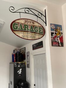 A garage art personalized sign hanging up in a customer garage