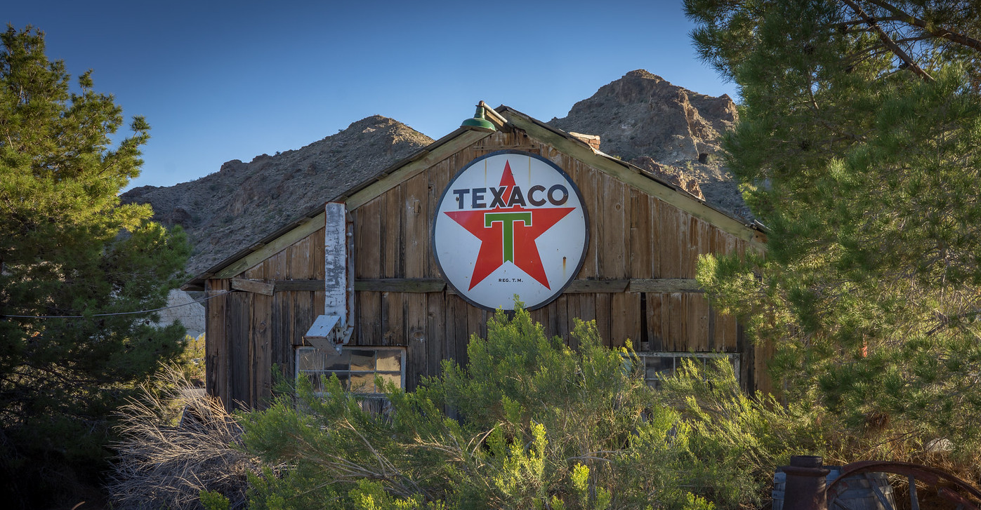A cool photo with a Big Texaco sign hung up in the middle of the peak